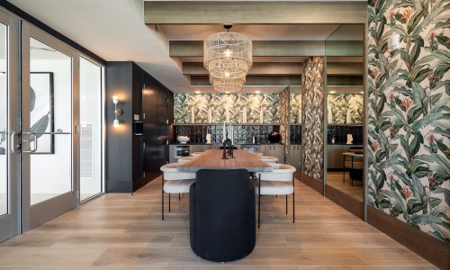 a clubroom with a table and chairs