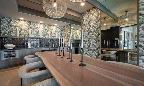 a clubroom with a table and chairs