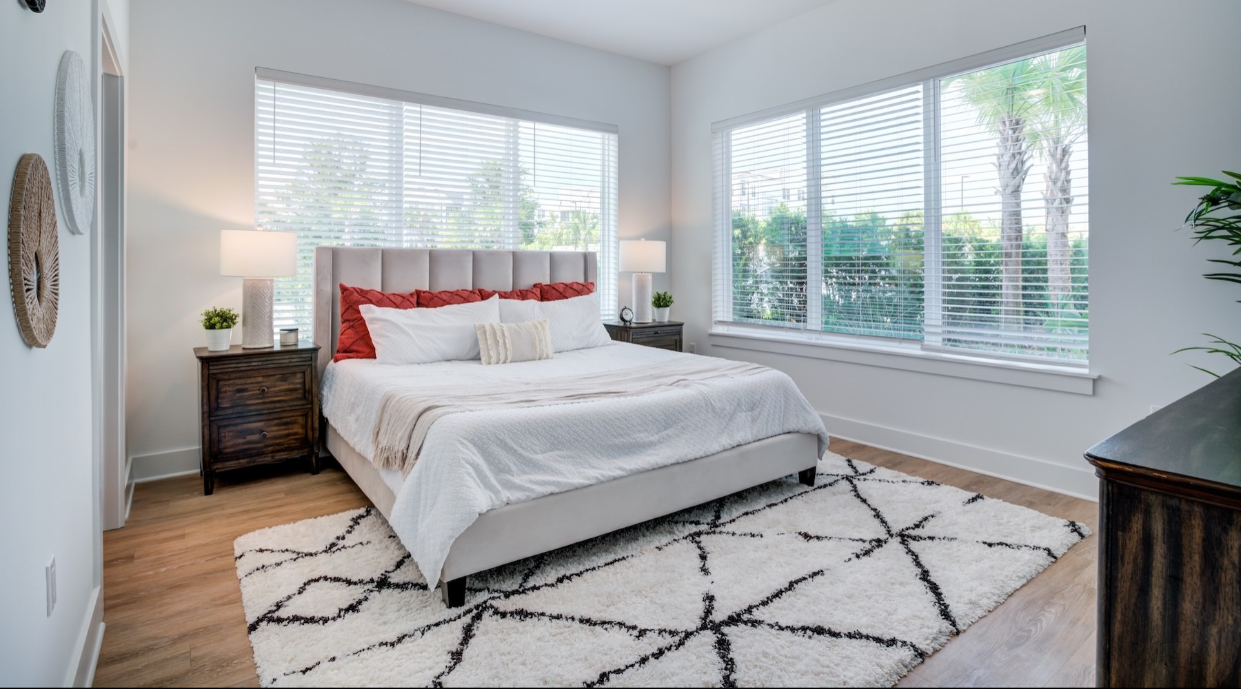 a bedroom with a bed and two nightstands