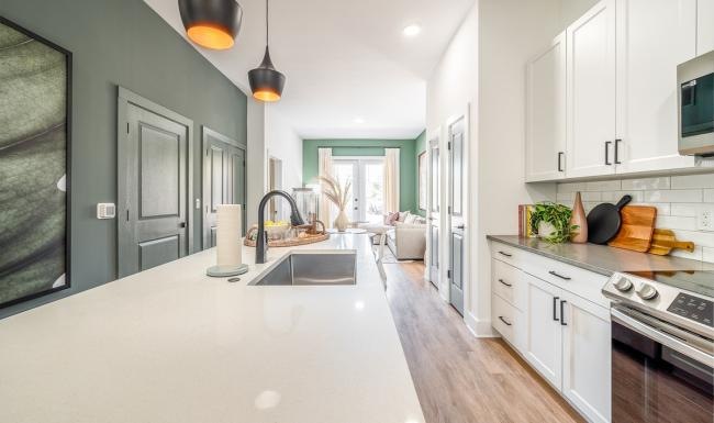 a kitchen with white cabinets